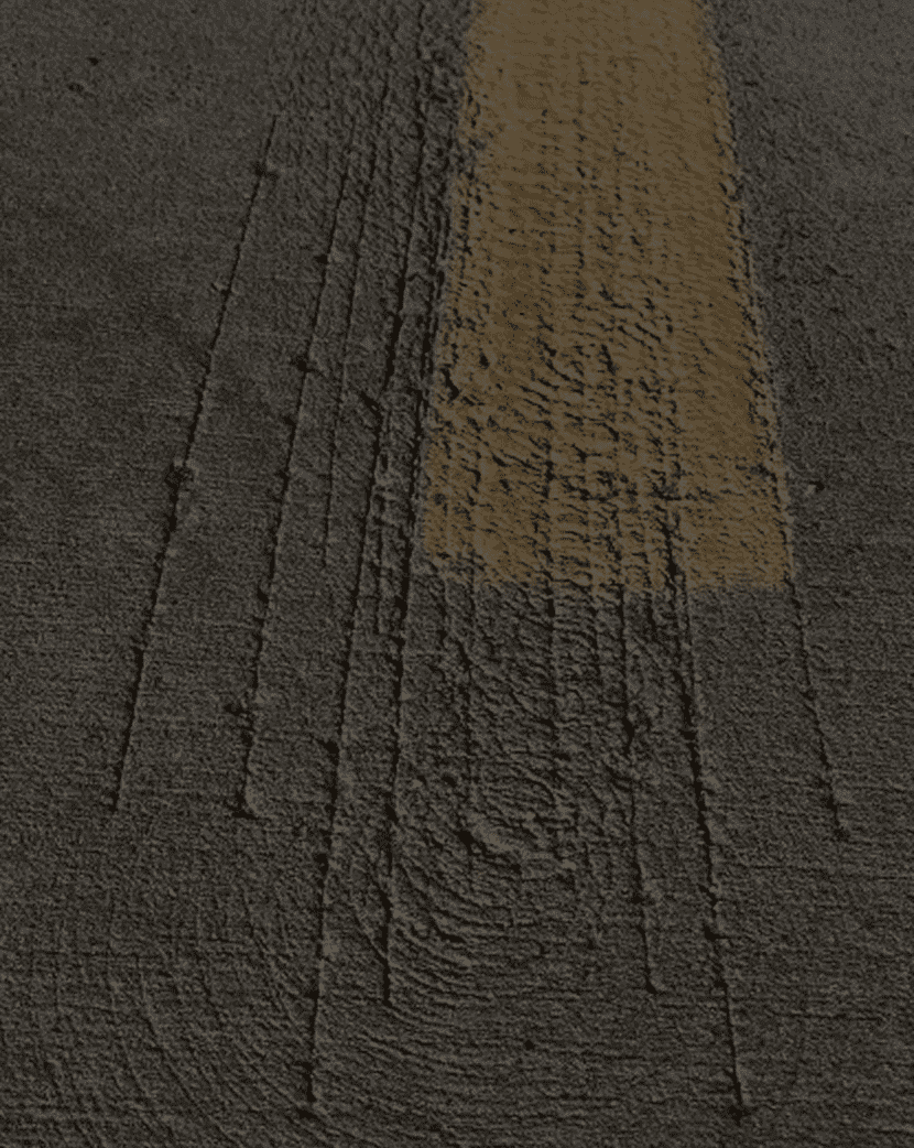 Textured asphalt with yellow stripe