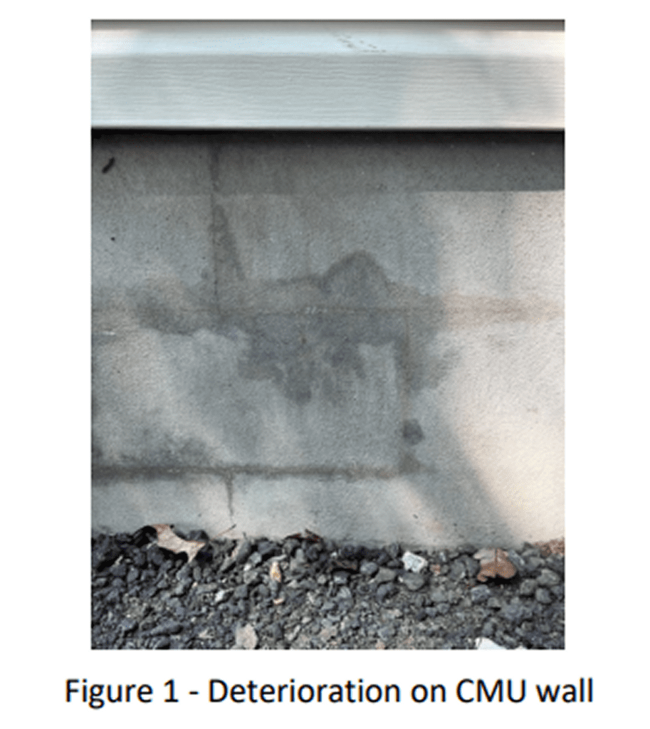 Wall showing water stains and discoloration from moisture damage.