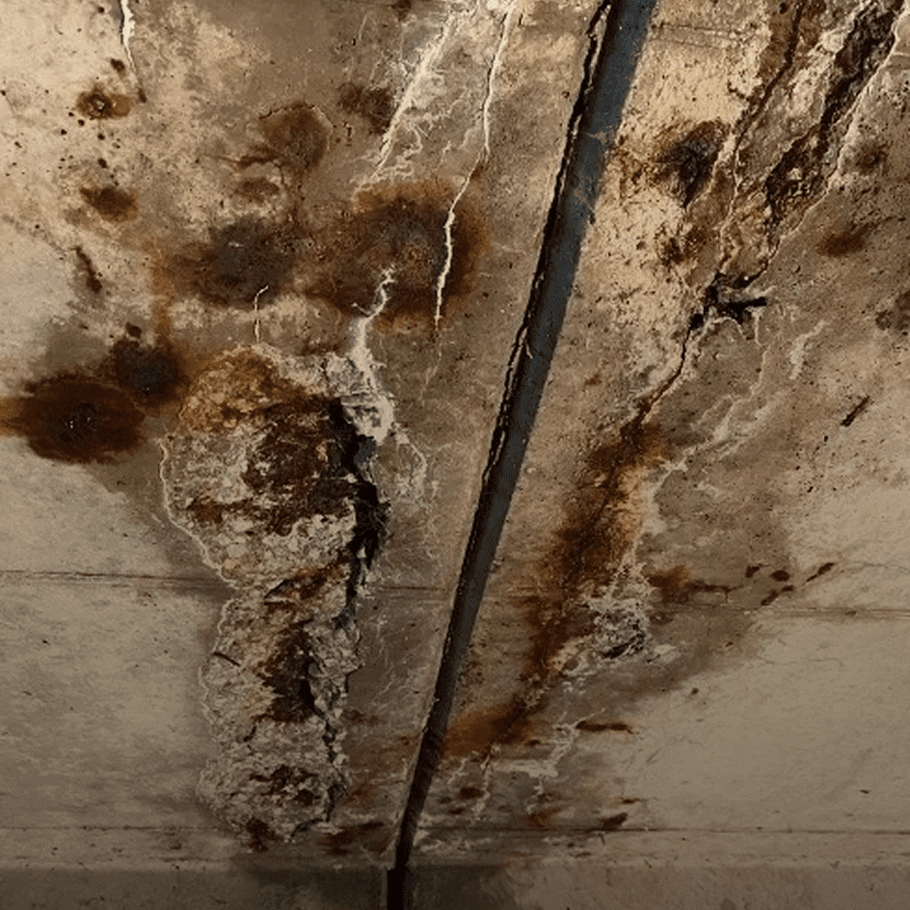 Cracks and discoloration on concrete surface